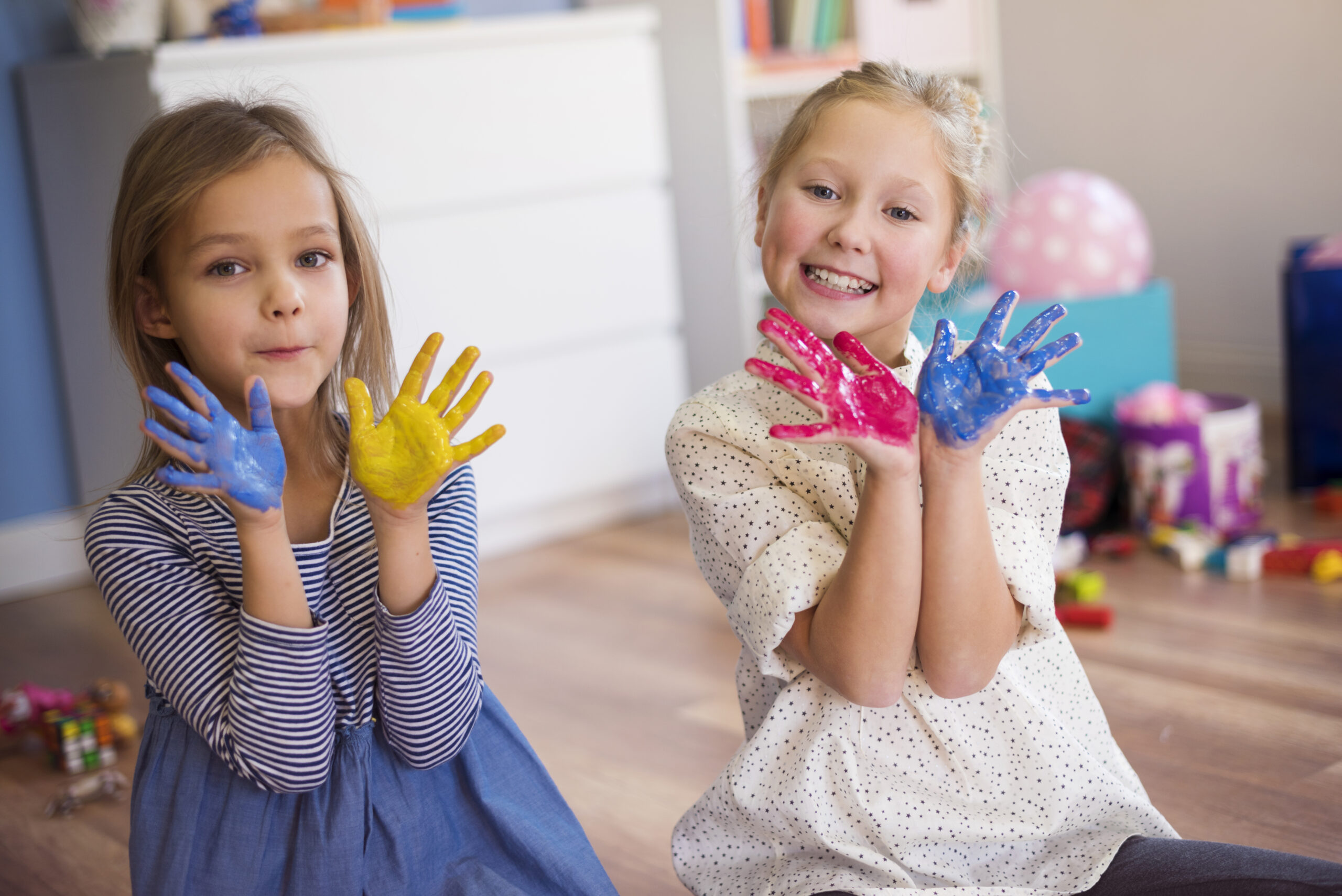 colorful hands presented by cute girls scaled